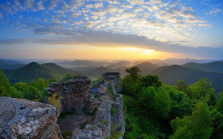 Mountain range sunset landscape bernd - a view of a mountain range free wallpaper