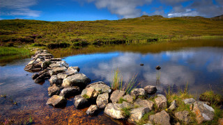 Stone wall water grassy hill - a stone wall free wallpaper for desktop