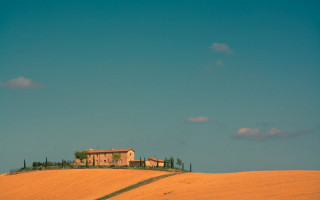 House hill sky clouds green - a green field in the foreground free wallpaper