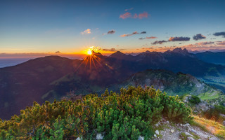 Sunset mountain range trees clouds - a sunset over a mountain range free wallpaper