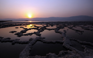 Sunset rocks star pattern water - a large star free wallpaper