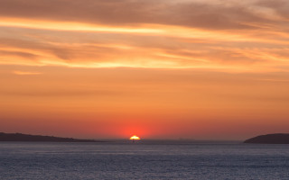 Sunset water boat hill trees - free sunset wallpaper