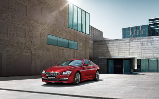 Red car building window city - a red car free wallpaper