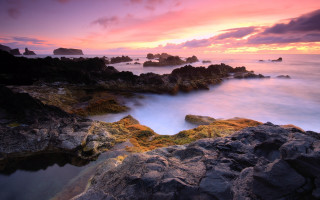Rocky beach sunset clouds foreground - a few rock free wallpaper