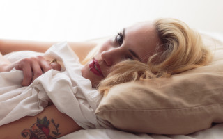 Woman tattoo bed promotional realistic - her stomach free wallpaper