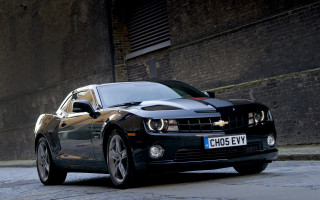 Black car road brick wall - the side of a road next free wallpaper