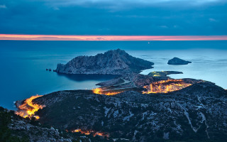 Mountain lake island night city - a view of a mountain free wallpaper