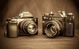 Two old cameras tabletop brown - zenith view free wallpaper