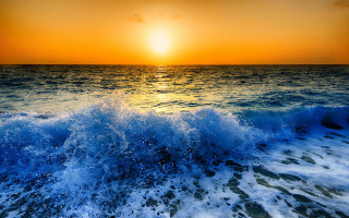 Sunset ocean wave orange sky 2 - a sunset over the ocean free wallpaper