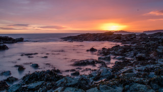 Sunset rocky beach water cityscape 2 - rich moody colour free wallpaper