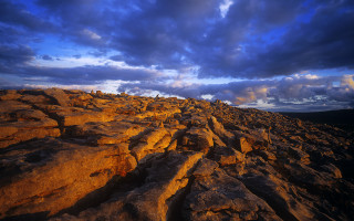 Rocky landscape cloudy sky dusk - a rocky landscape free wallpaper for desktop