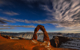 Desert rock formation cloudy sky 5 - a mountain range in the distance free wallpaper