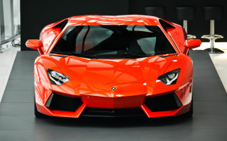 Bright orange sports car showroom 2 - orange sports car free wallpaper
