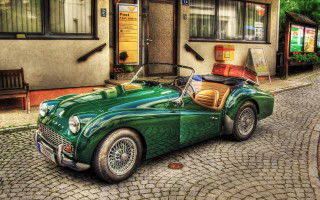 Green sports car cobblestone street - a cobblestone street in front free wallpaper for desktop