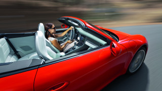 Woman driving red sports car - a red sports car free wallpaper