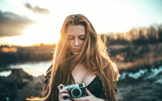 Woman holding camera beach lake - the camera len free wallpaper