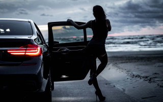 Woman out car beach night - luxury free wallpaper
