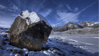 Large rock snowy field mountains - wispy free wallpaper