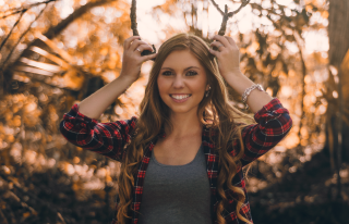 Woman long hair plaid shirt - both hand free wallpaper