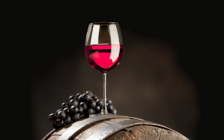 Wine glass on barrel grapes - caravaggio free wallpaper