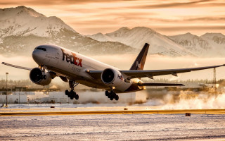 Plane takeoff mountains fog backlit - an airport runway free wallpaper