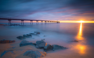 Sunset pier ocean rocks city - sunset over the ocean free wallpaper for desktop