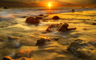 Sunset ocean rocks distant sun - rock free wallpaper