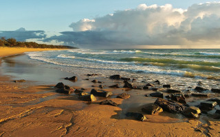 Beach rocks cloudy sky ocean - a bunch of rocks free wallpaper