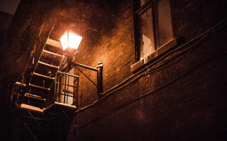 Streetlight brickbuilding stairway window night - a street light free wallpaper