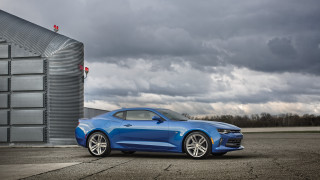 Blue car building cloudy sky - a blue car free wallpaper for desktop
