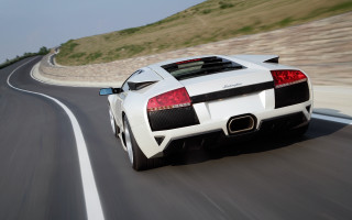 White sports car driving hillside - motion blur free wallpaper for desktop