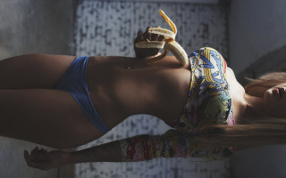 Woman bikini banana tattoo piercing - a wall behind her free wallpaper