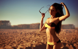 Beach woman scissors bikini cityscape - a woman in a bikini holding free wallpaper