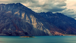 Mountain island water cloudy sky - a small island in the middle of the water free wallpaper
