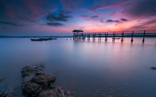 Sunset pier boat colorful sky - a colorful sky in the background free wallpaper