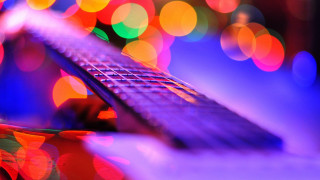 Guitar neck bokeh lensflare sky - a close up of a guitar neck free wallpaper