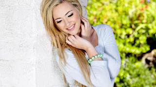 Woman smiling bracelet outdoor portrait - her wrist free wallpaper