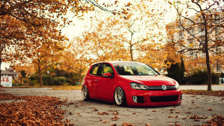 Red car autumn leaves tree - a street next free wallpaper