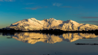 Mountain lake clouds snow capped 2 - a few snow free wallpaper