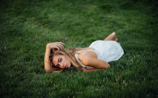 Woman white dress laying grass - claire hummel free wallpaper