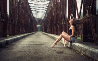 Woman bridge hair blowing arabesque - her leg bent free wallpaper