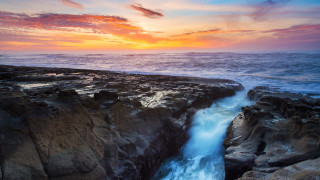 Sunset rocky beach waterfall ocean 2 - over the water free wallpaper for desktop