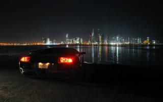 Car night cityscape reflection lights - a city in the background free wallpaper for desktop