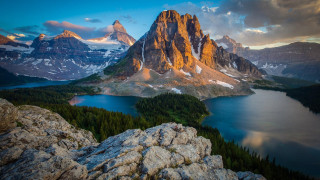 Mountain lake forest sky water - a lake in the foreground and a mountain range in the background free wallpaper
