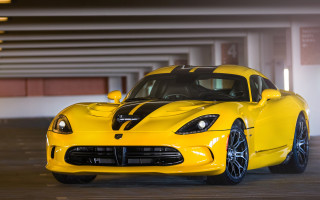 Yellow sports car parking garage - a black stripe free wallpaper
