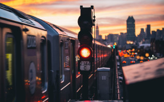Train city sunset skyline blurry - a city skyline in the background free wallpaper