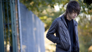 Man standing fence hands on - his hip free wallpaper for desktop