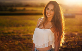 Woman field blowing hair smile - free light wallpaper