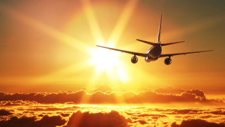 Airplane sunset clouds backlit dusk - the sun shining behind free wallpaper