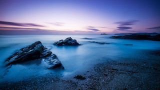 Purple sky beach rocks long - rich moody colour free wallpaper